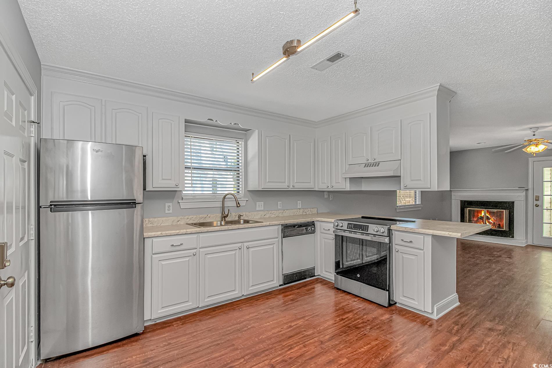 5173 Inlet Garden Court, Unit 7A Murrells Inlet, SC 29576 - Photo 2 of 19 Kitchen with visible vents, under cabinet range ho