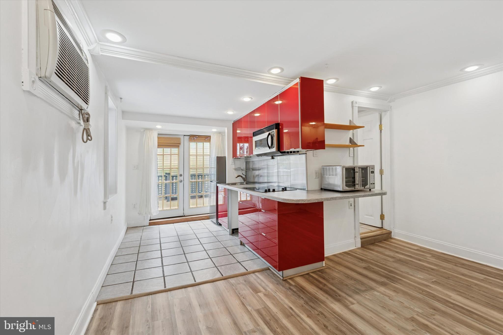2621 Sepviva Street Philadelphia, PA 19125 - Photo 12 of 26 a kitchen with stainless steel appliances granite countertop a stove and a sink