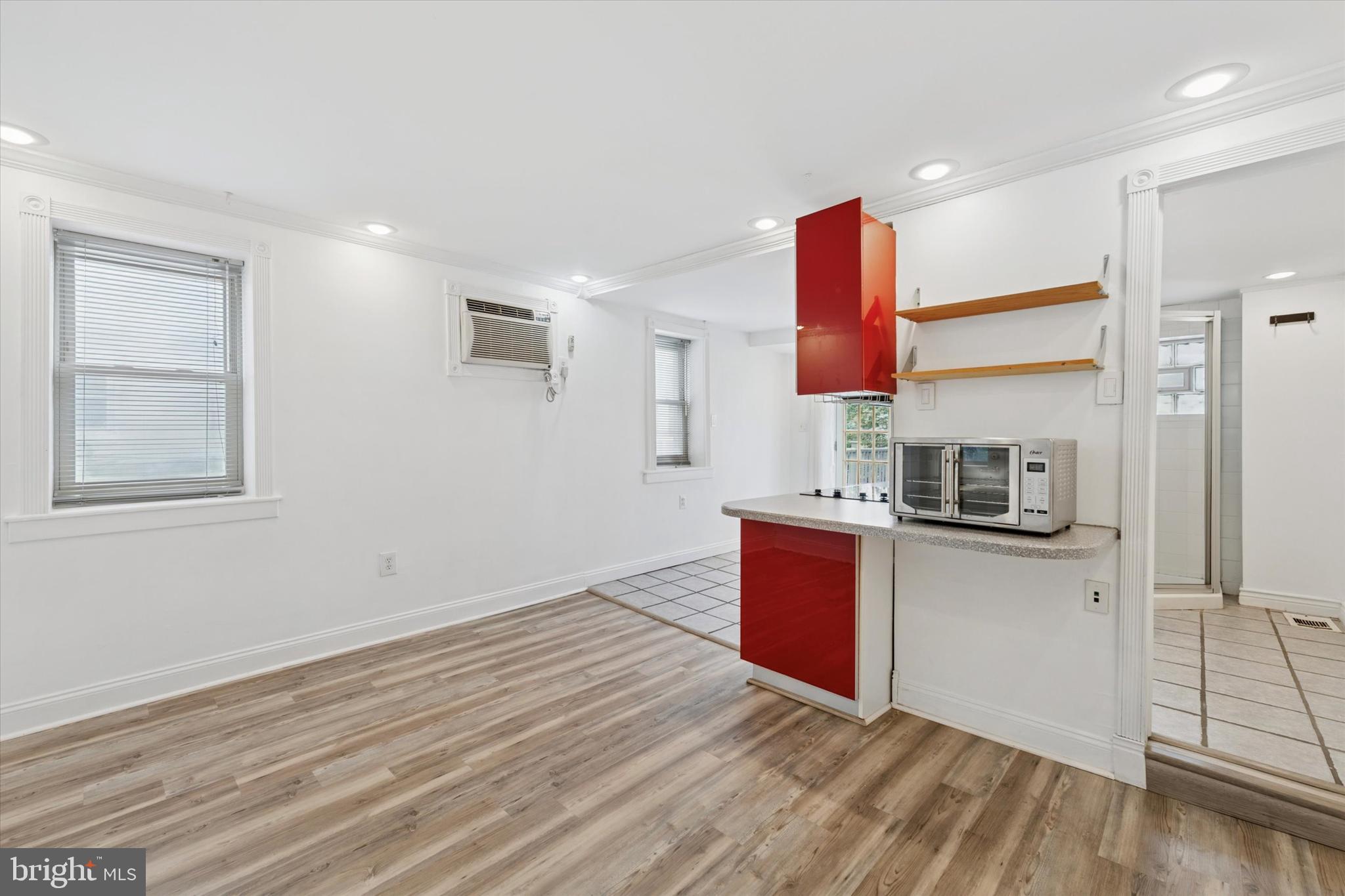 2621 Sepviva Street Philadelphia, PA 19125 - Photo 21 of 26 a kitchen with stainless steel appliances granite countertop a sink and dishwasher a stove with wooden floor