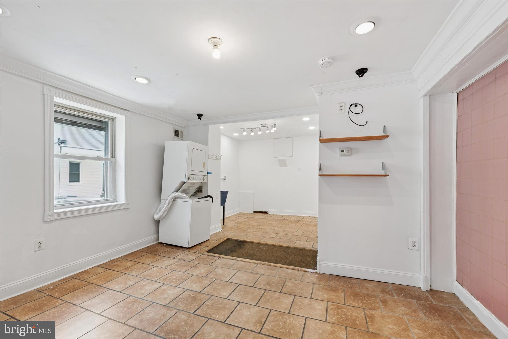 2621 Sepviva Street Philadelphia, PA 19125 - Photo 7 of 26 a room with a baby crib and a window