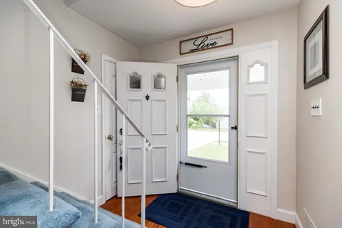 a view of entryway with wooden floor