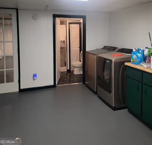 a utility room with washer and dryer