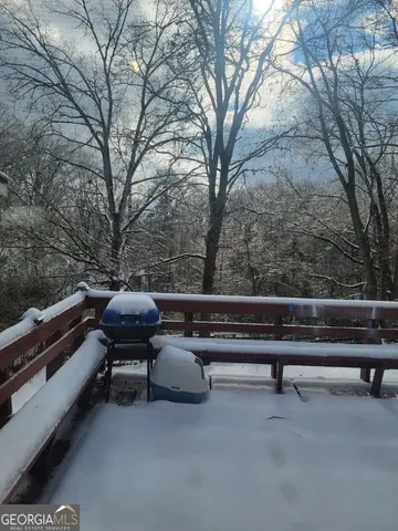 a view of outdoor space with lounge chairs
