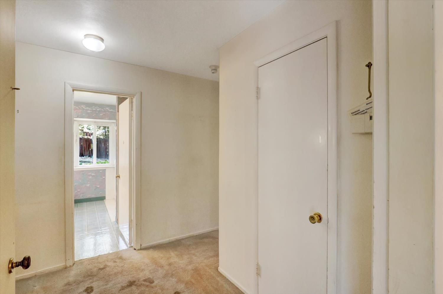 10124 South Ponderosa Way Rough and Ready, CA 95975 - Photo 25 of 63 a view of a room that has a door in it