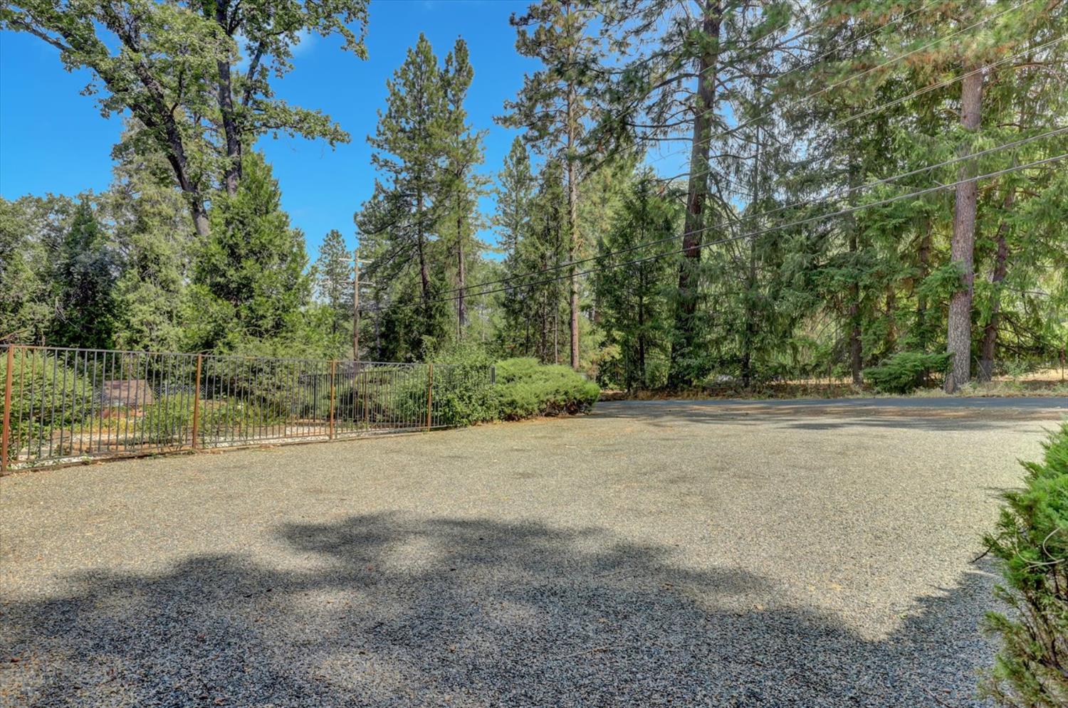 10124 South Ponderosa Way Rough and Ready, CA 95975 - Photo 29 of 63 a view of a field with trees in background