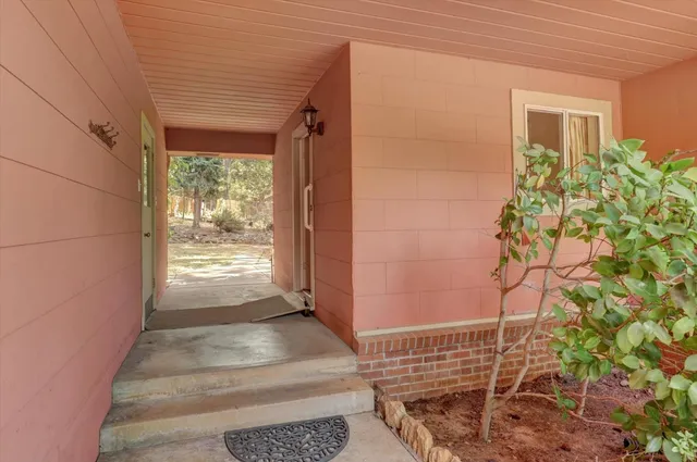 a view of a swimming pool with a yard