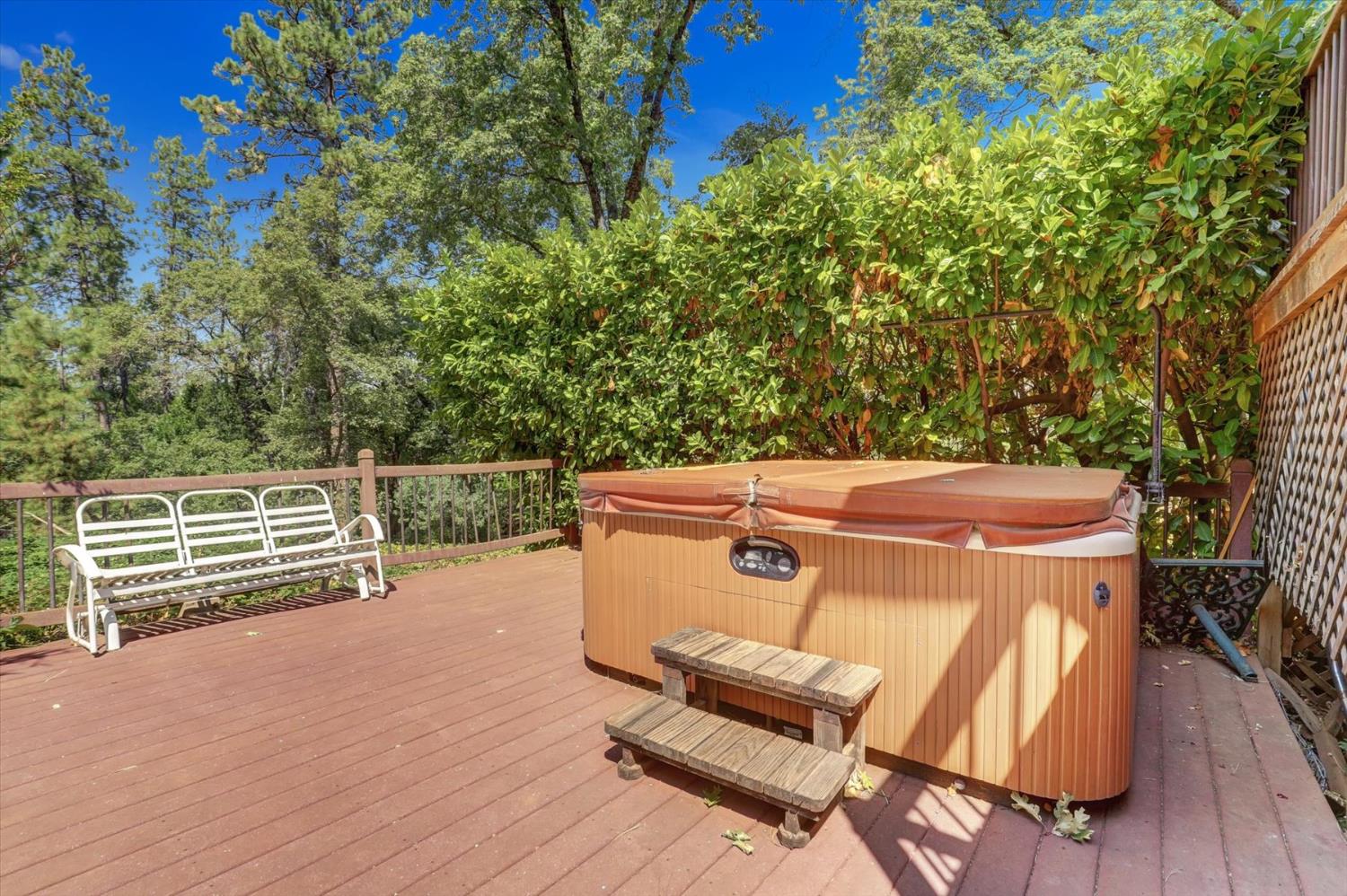 10124 South Ponderosa Way Rough and Ready, CA 95975 - Photo 37 of 63 a view of a chairs and table on the wooden floor