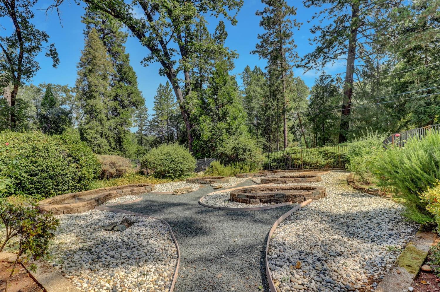 10124 South Ponderosa Way Rough and Ready, CA 95975 - Photo 40 of 63 a view of a road with a yard