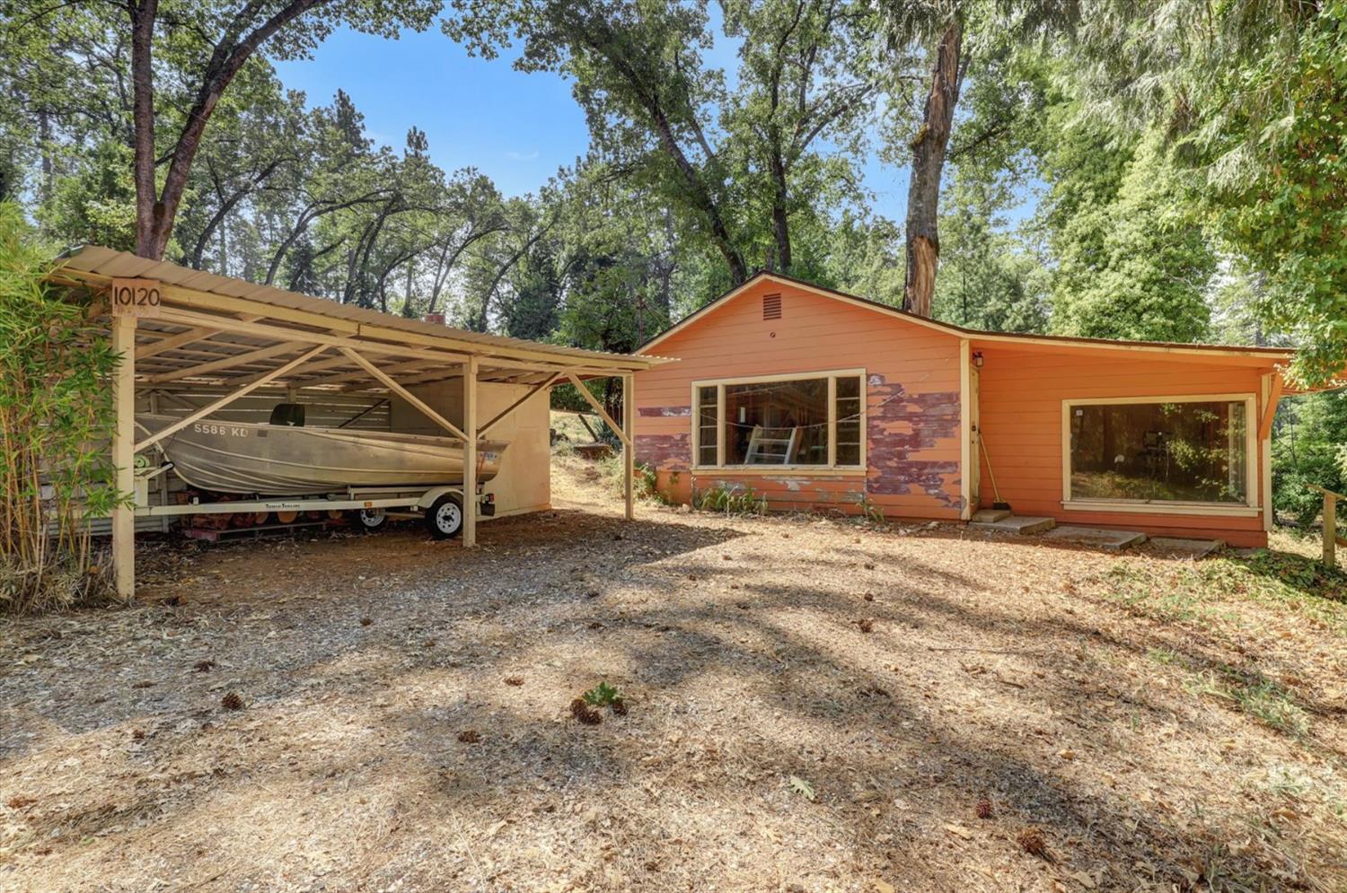 10124 South Ponderosa Way Rough and Ready, CA 95975 - Photo 61 of 63 a house with trees in the background