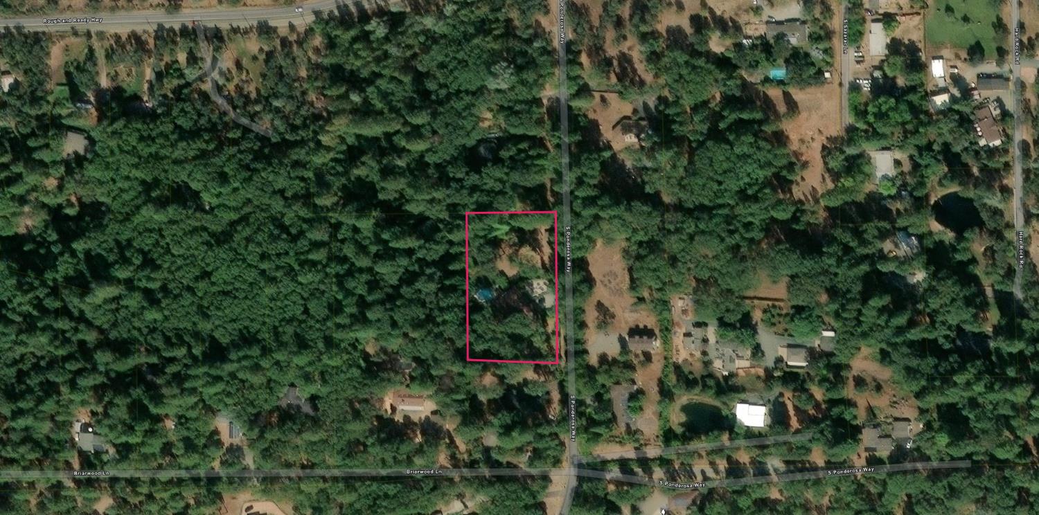 10124 South Ponderosa Way Rough and Ready, CA 95975 - Photo 63 of 63 a view of a house with a lush green forest