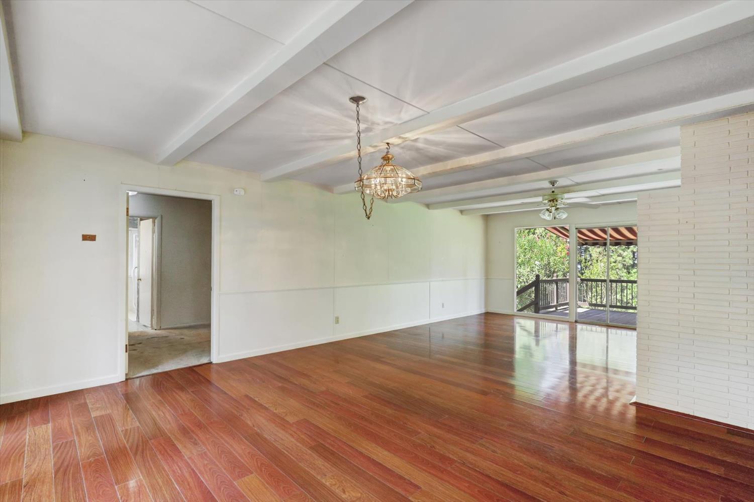 10124 South Ponderosa Way Rough and Ready, CA 95975 - Photo 10 of 63 wooden floor in an empty room with a window