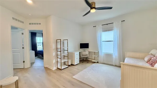 a view of a livingroom with furniture and a flat screen tv