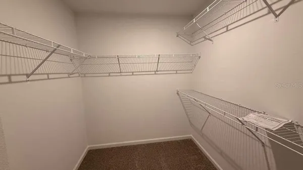 a view of a room with racks on the wall