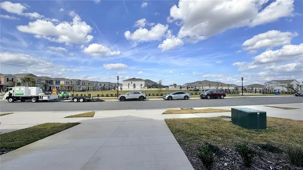 an aerial view of a house with yard swimming pool and outdoor seating