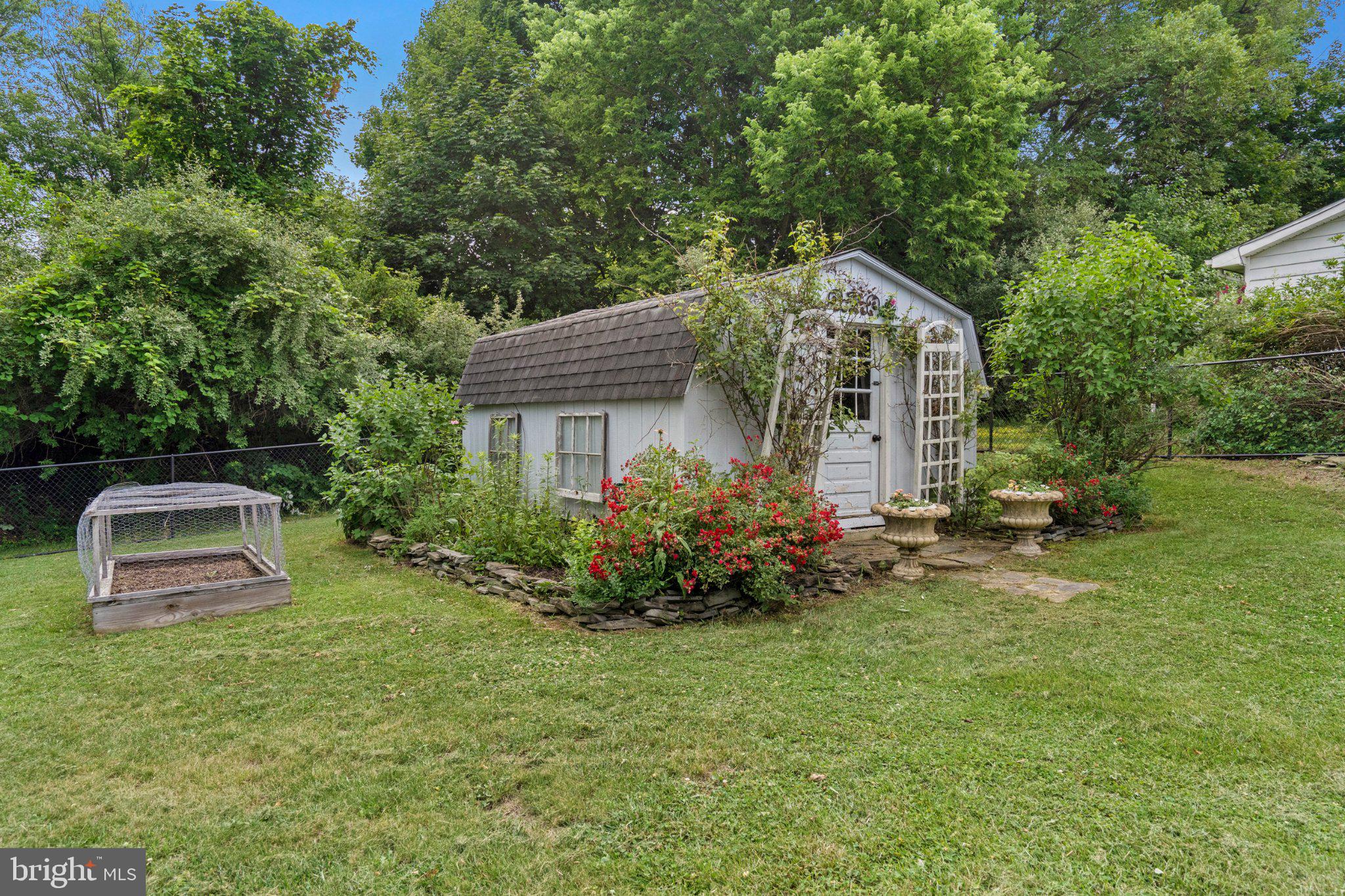 3153 Charles Town Road Kearneysville, WV 25430 - Photo 25 of 29 Charming garden retreat with lush greenery.