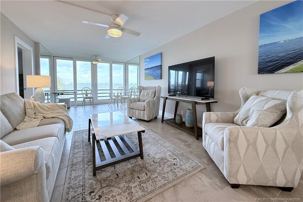 1950 Southwest Palm City Road, Unit 14305 Stuart, FL 34994 - Photo 19 of 70 a living room with furniture and a flat screen tv