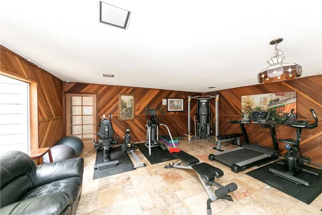 a room with gym equipment and a large window