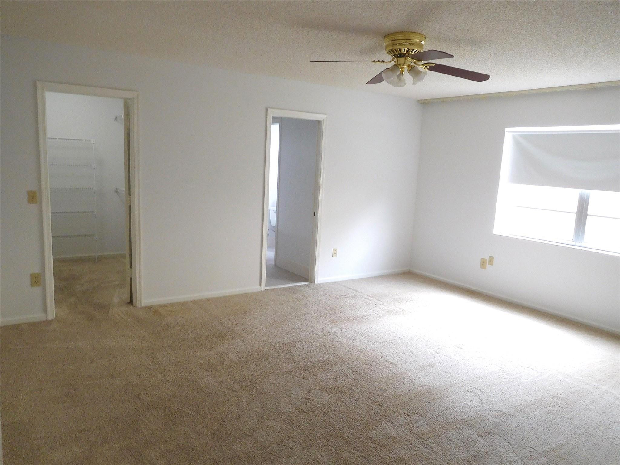 23140 Southwest 55th Avenue Boca Raton, FL 33433 - Photo 14 of 39 a view of an empty room with a window