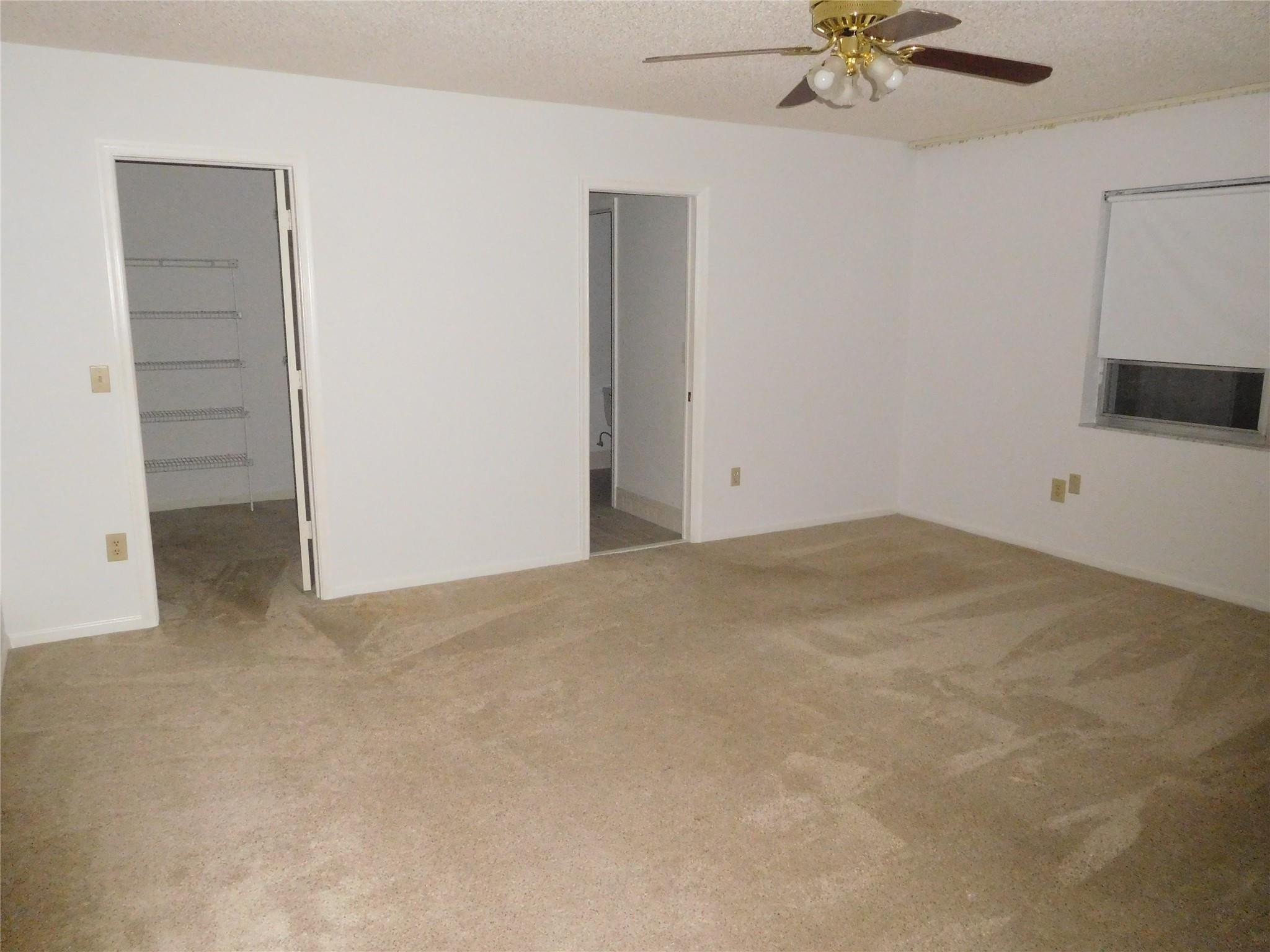 23140 Southwest 55th Avenue Boca Raton, FL 33433 - Photo 34 of 39 an empty room with a empty space and a ceiling fan