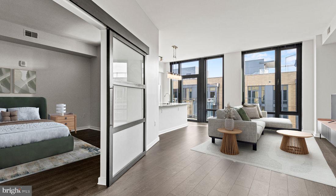 8300 Wisconsin Avenue, Unit 1B1447 Bethesda, MD 20814 - Photo 12 of 25 a living room with furniture and a large window