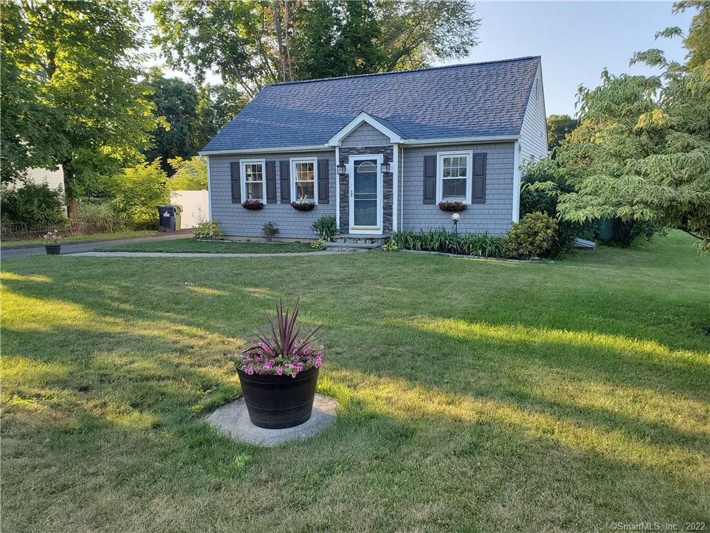 10 Dixon Road Danbury, CT 06811 - Photo 1 of 1 a front view of a house with a garden