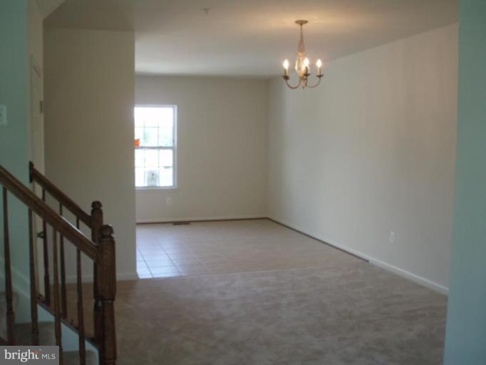 8170 Mission Road Jessup, MD 20794 - Photo 2 of 12 a view of a chandelier in big room and chandelier