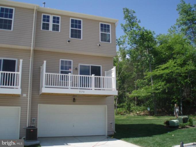 8170 Mission Road Jessup, MD 20794 - Photo 12 of 12 a front view of a house with a yard