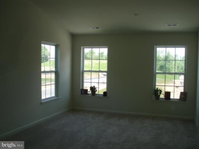 8170 Mission Road Jessup, MD 20794 - Photo 5 of 12 a view of an empty room with a window