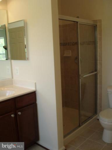 8170 Mission Road Jessup, MD 20794 - Photo 6 of 12 a bathroom with a sink a toilet and shower