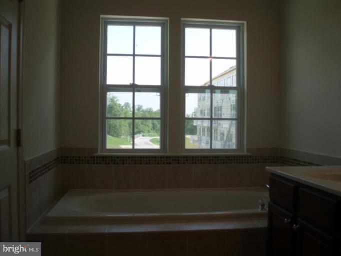 8170 Mission Road Jessup, MD 20794 - Photo 7 of 12 a bathroom with a bathtub