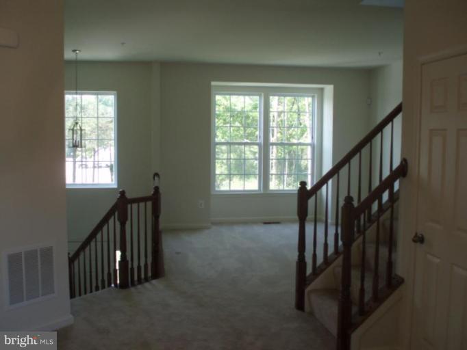 8170 Mission Road Jessup, MD 20794 - Photo 8 of 12 a view of hallway with stairs