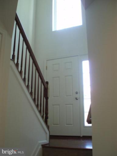 8170 Mission Road Jessup, MD 20794 - Photo 9 of 12 a view of staircase with wooden floor and stairs