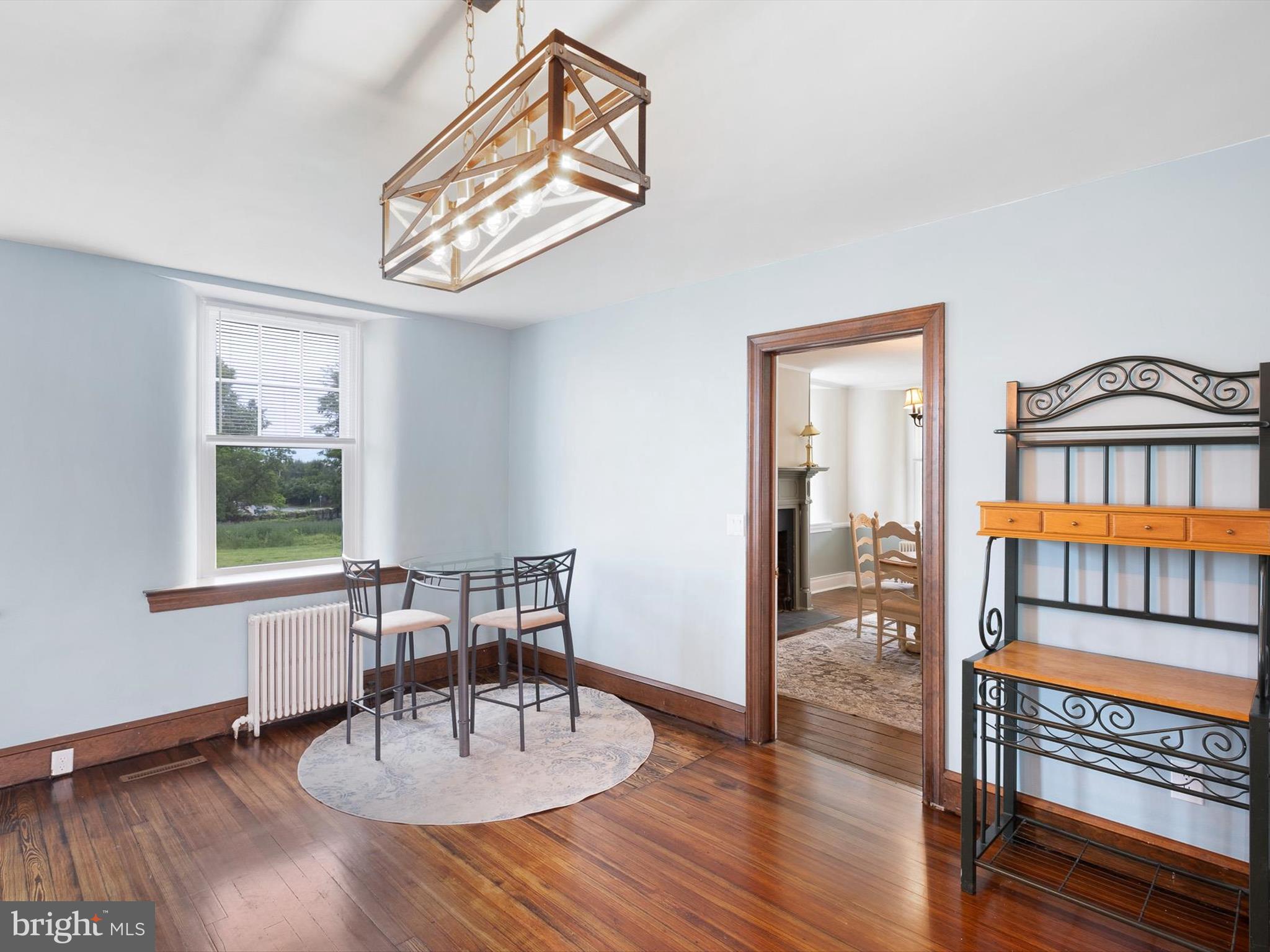 5961 Limestone Road Hockessin, DE 19707 - Photo 13 of 40 a dining room with furniture a window and wooden floor