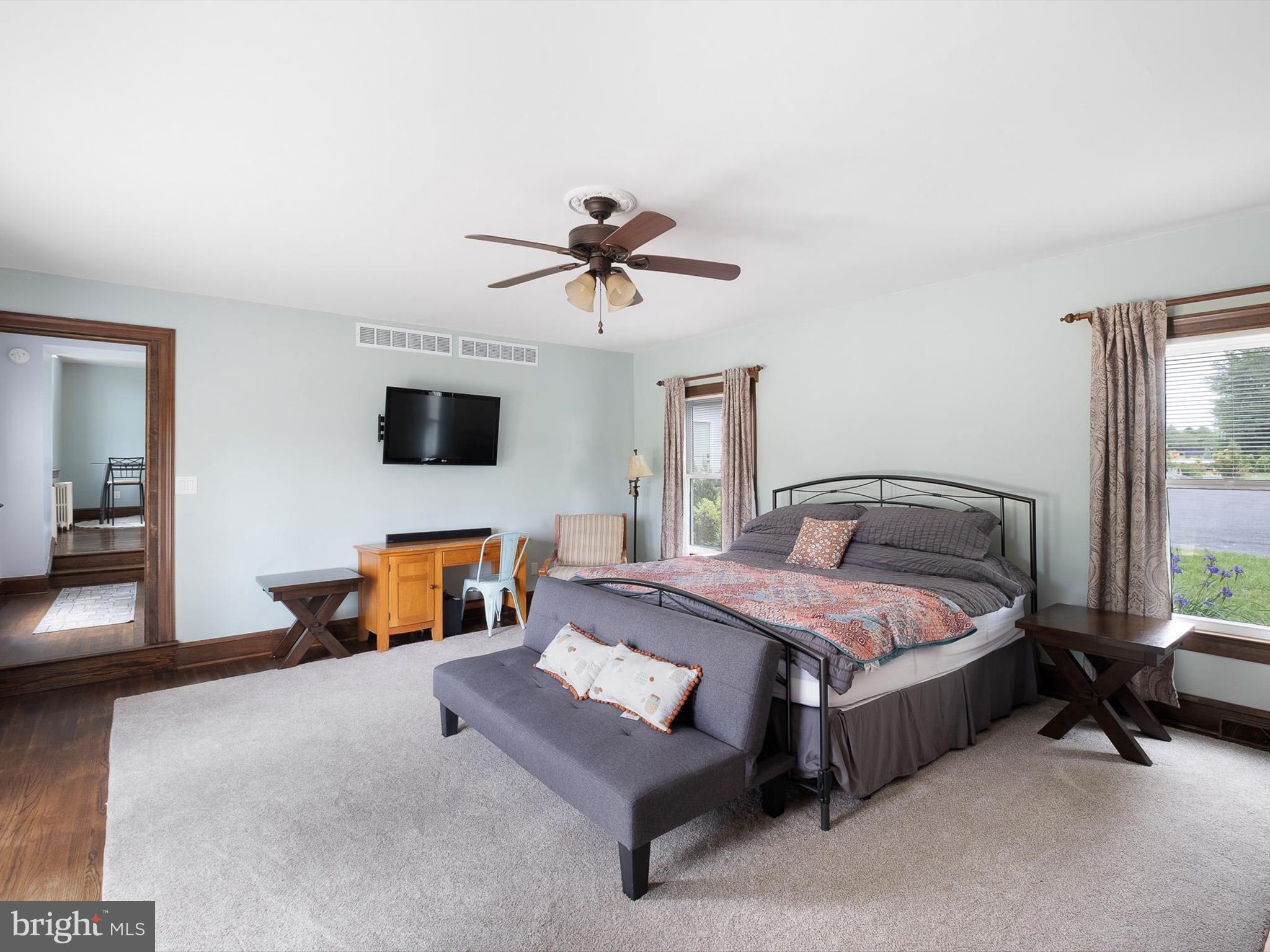 5961 Limestone Road Hockessin, DE 19707 - Photo 14 of 40 a bedroom with a bed and a chandelier
