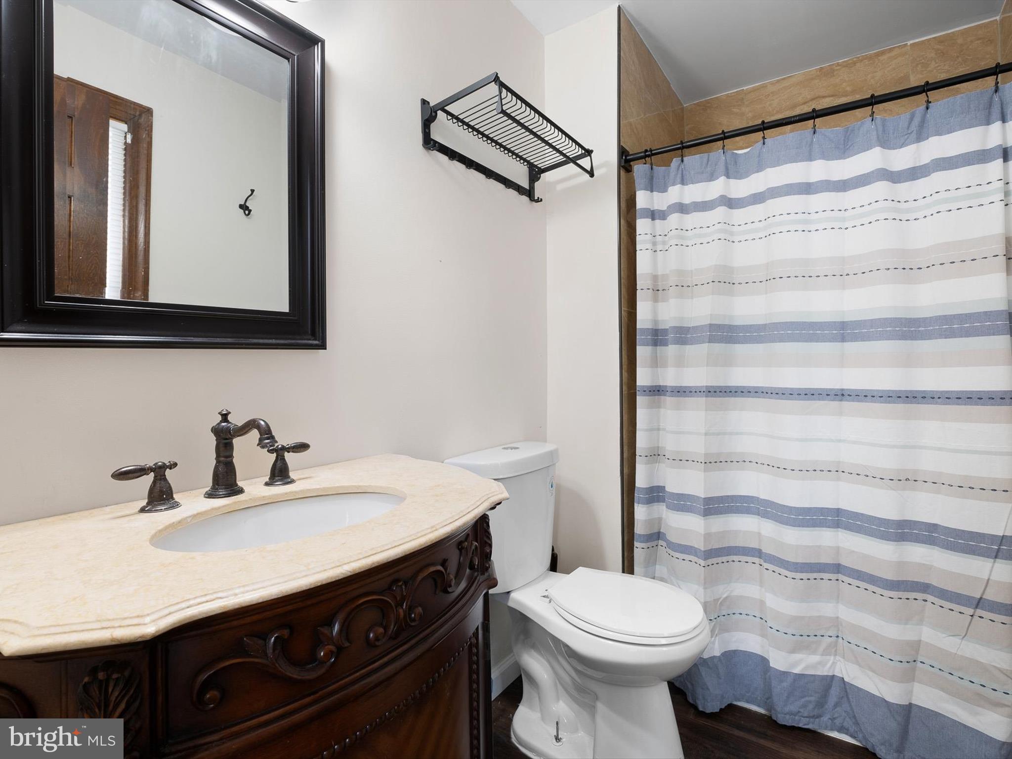 5961 Limestone Road Hockessin, DE 19707 - Photo 21 of 40 a bathroom with a sink toilet and shower