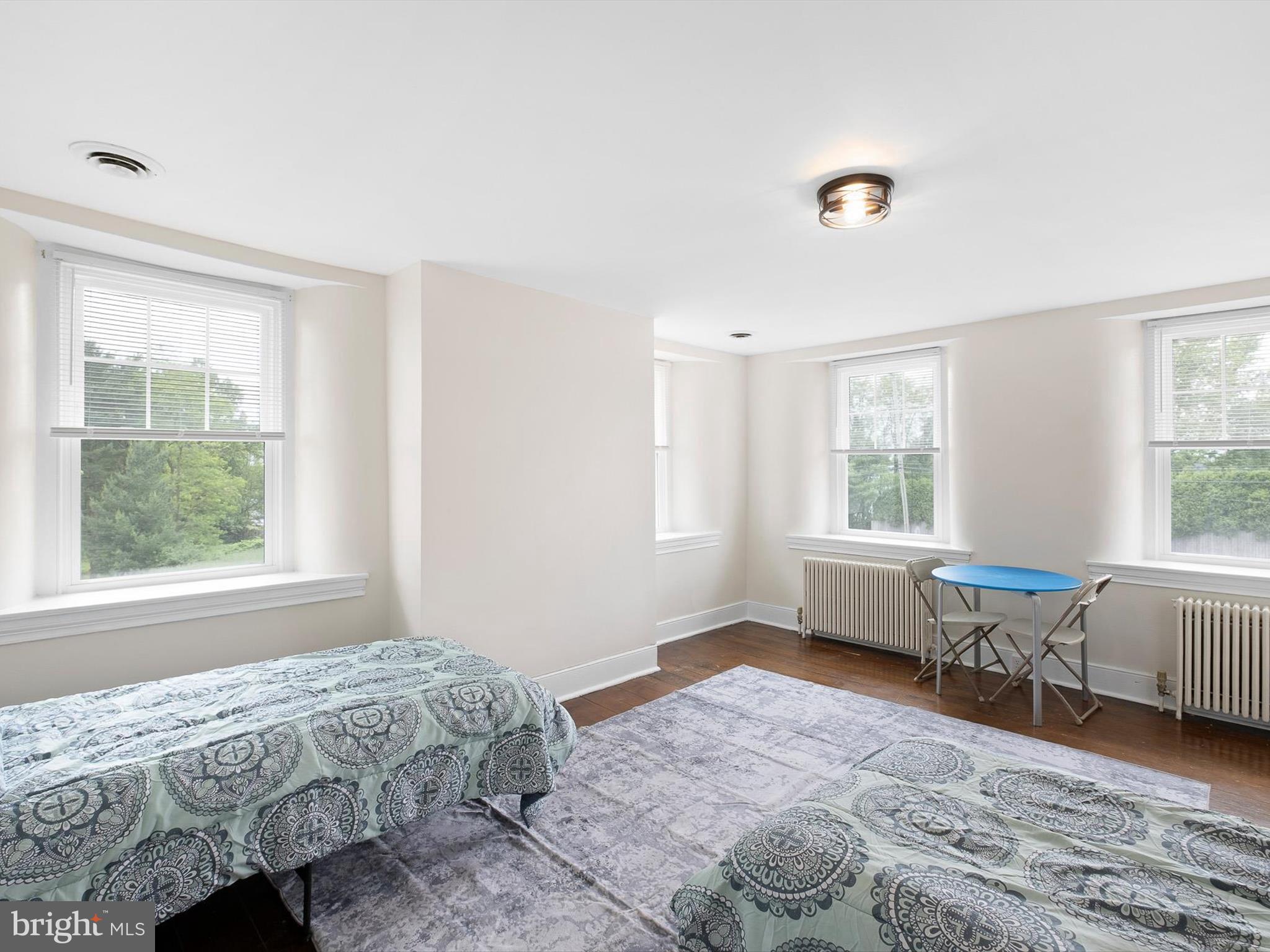5961 Limestone Road Hockessin, DE 19707 - Photo 27 of 40 a bedroom with a bed and a window