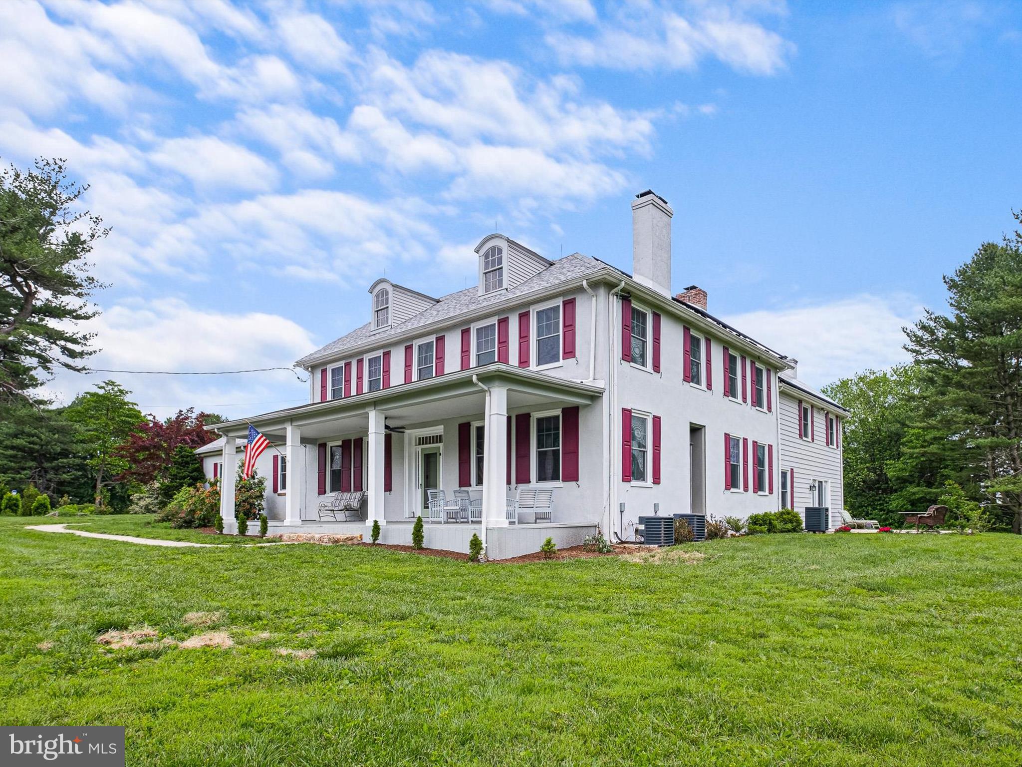 5961 Limestone Road Hockessin, DE 19707 - Photo 3 of 40 a front view of a house with a garden