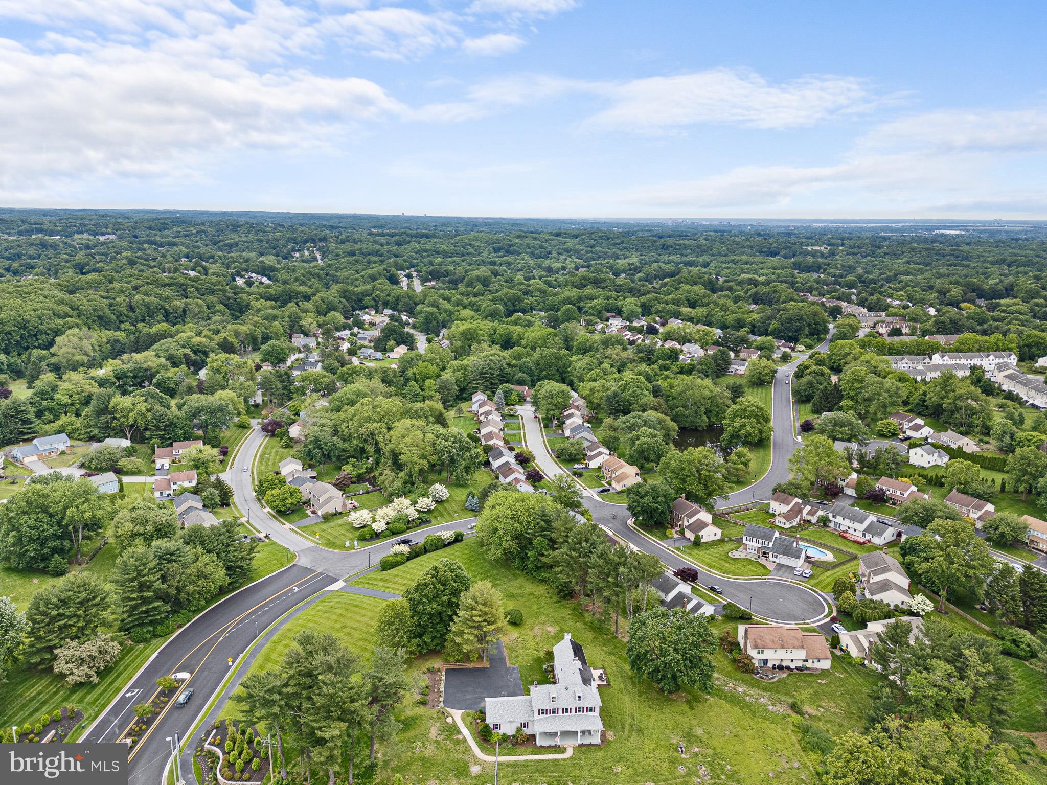 5961 Limestone Road Hockessin, DE 19707 - Photo 34 of 40 an aerial view of residential houses with outdoor space and trees