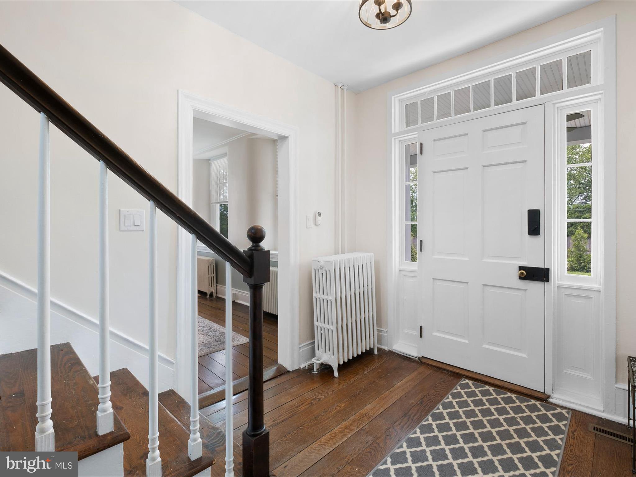 5961 Limestone Road Hockessin, DE 19707 - Photo 5 of 40 a view of entryway with wooden floor and stairs