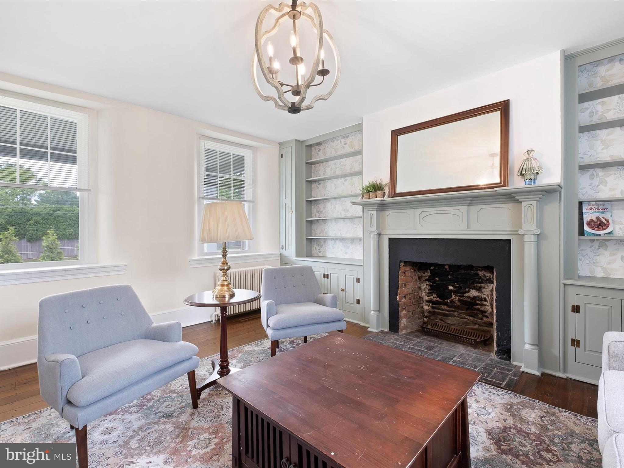5961 Limestone Road Hockessin, DE 19707 - Photo 6 of 40 a living room with furniture and a fireplace