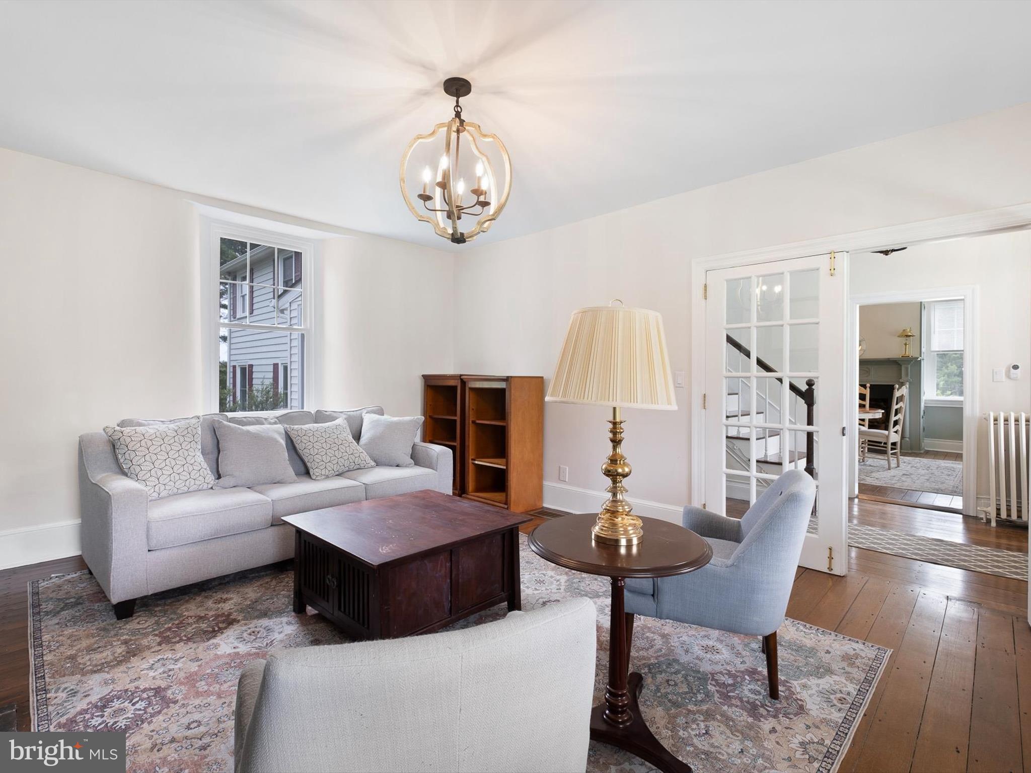 5961 Limestone Road Hockessin, DE 19707 - Photo 7 of 40 a living room with furniture chandelier and a table