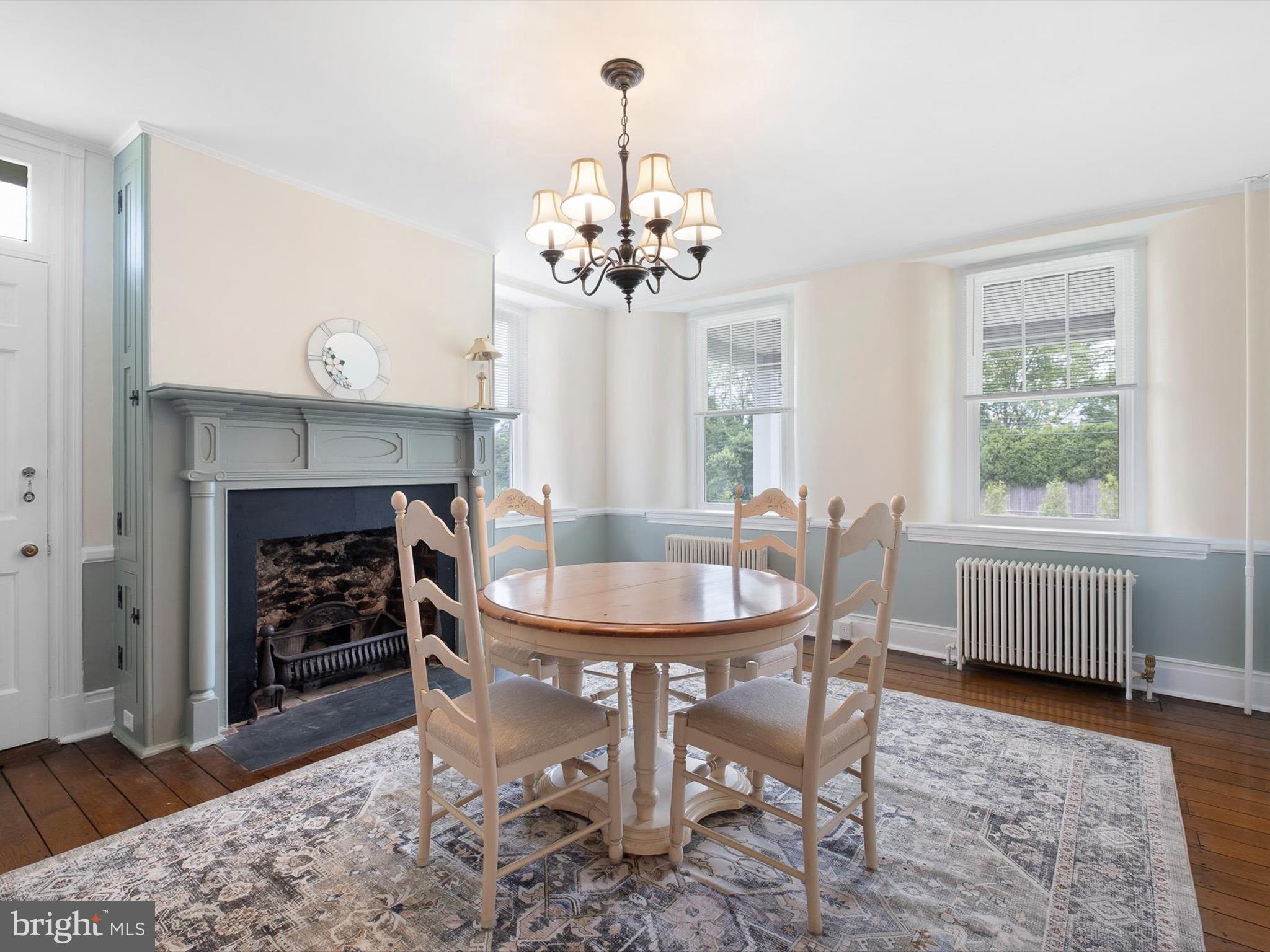 5961 Limestone Road Hockessin, DE 19707 - Photo 8 of 40 a dining room with furniture a chandelier and wooden floor