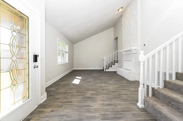 a view of entryway with wooden floor