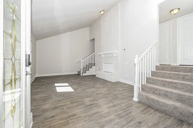 a view of entryway with wooden floor