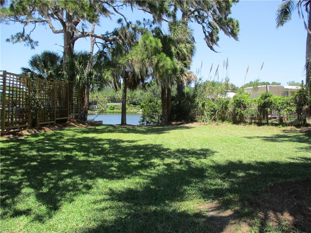 0 Edgewater New Port New Port Richey, FL 34652 - Photo 1 of 1 a view of a backyard with a garden