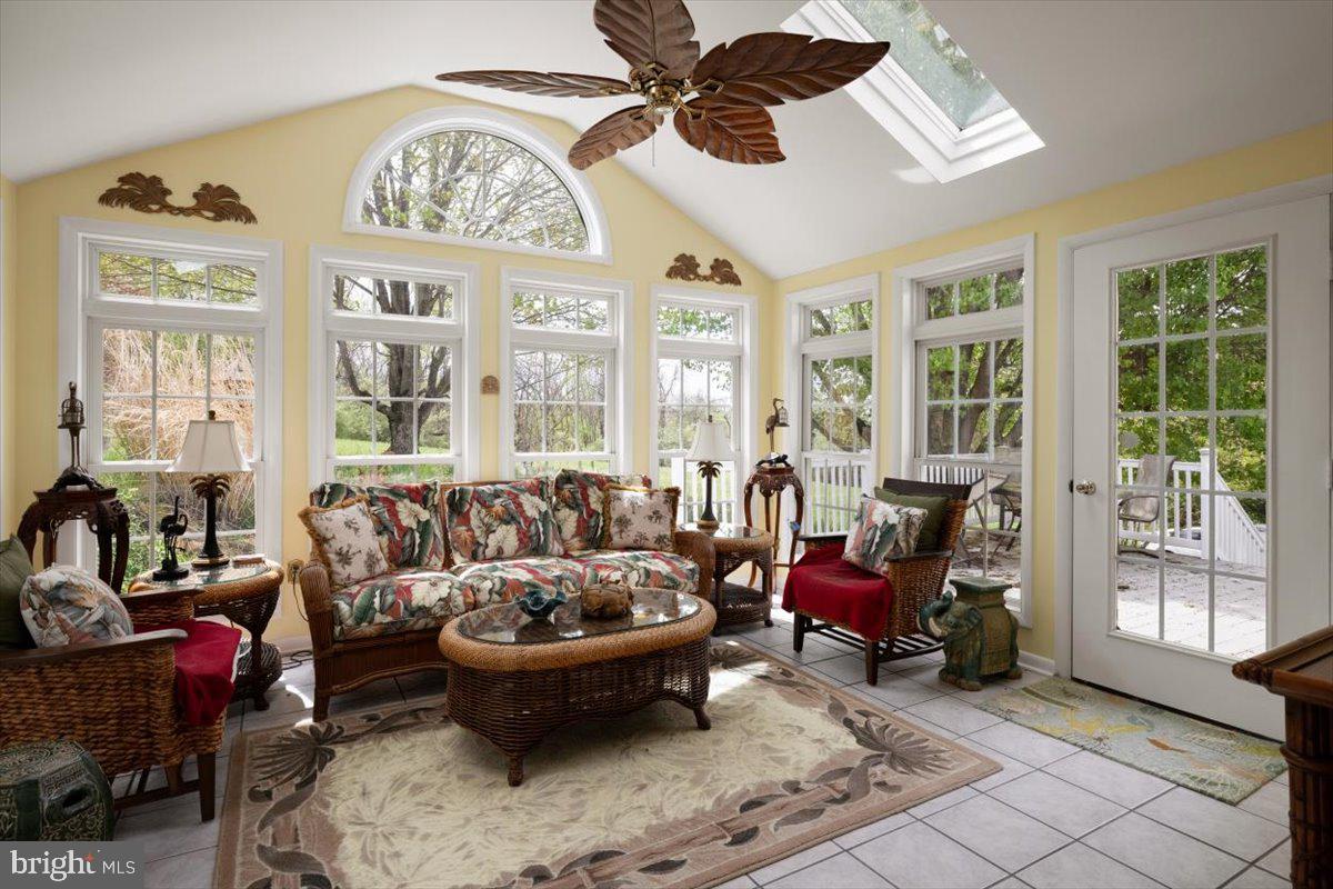 1049 Laurel Grove Road Winchester, VA 22602 - Photo 5 of 42 a living room with furniture a chandelier and a large window