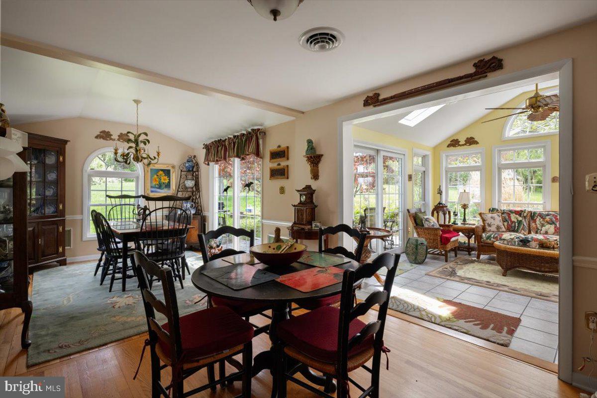 1049 Laurel Grove Road Winchester, VA 22602 - Photo 6 of 42 a view of a dining room and livingroom with furniture window and wooden floor