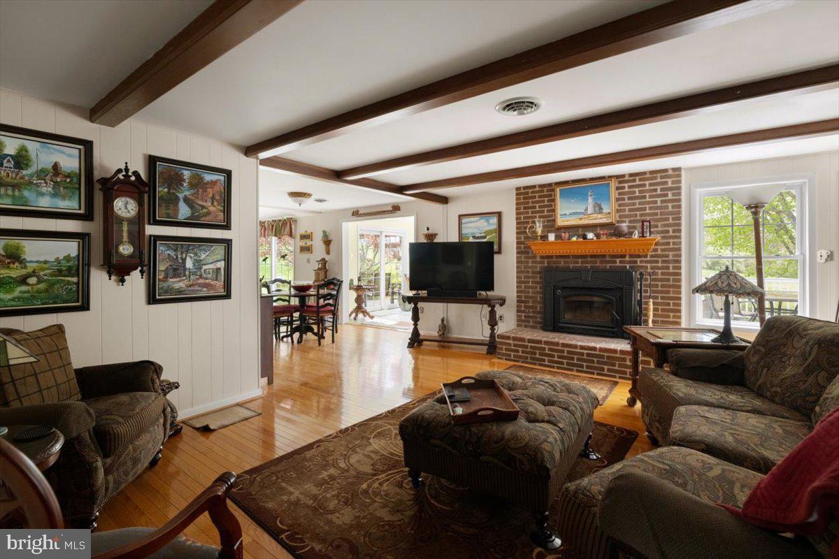 1049 Laurel Grove Road Winchester, VA 22602 - Photo 9 of 39 a living room with furniture or couch and a flat screen tv