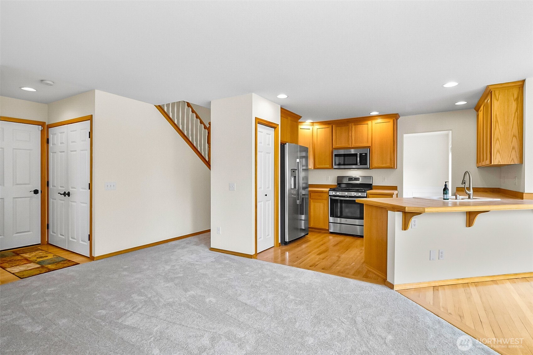 18410 11th Drive Southeast Bothell, WA 98012 - Photo 17 of 40 a kitchen with stainless steel appliances granite countertop a refrigerator and a stove top oven