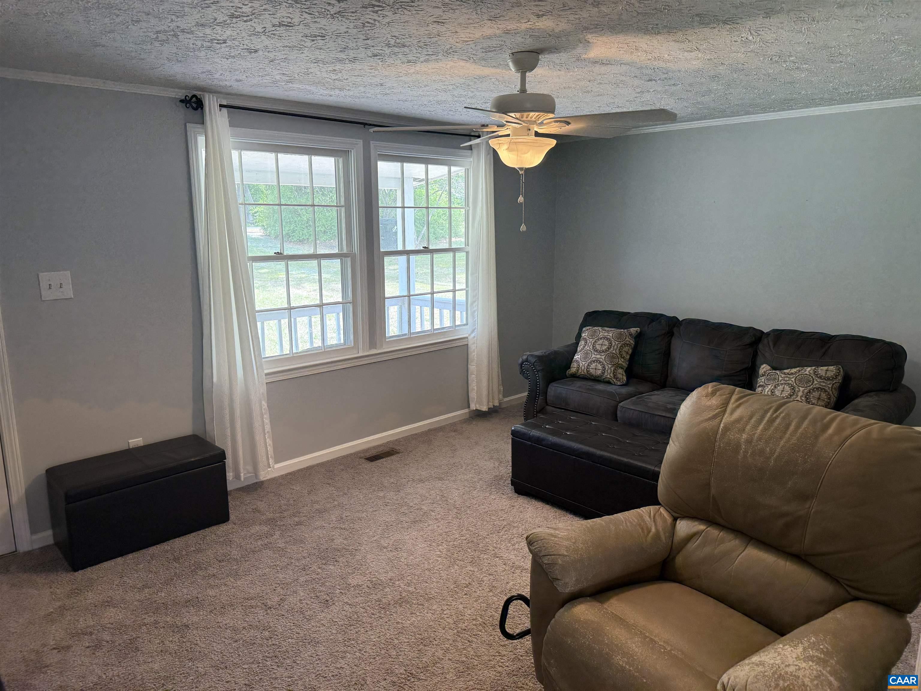 2002 Oliver Creek Road Troy, VA 22974 - Photo 3 of 38 a living room with furniture and a window